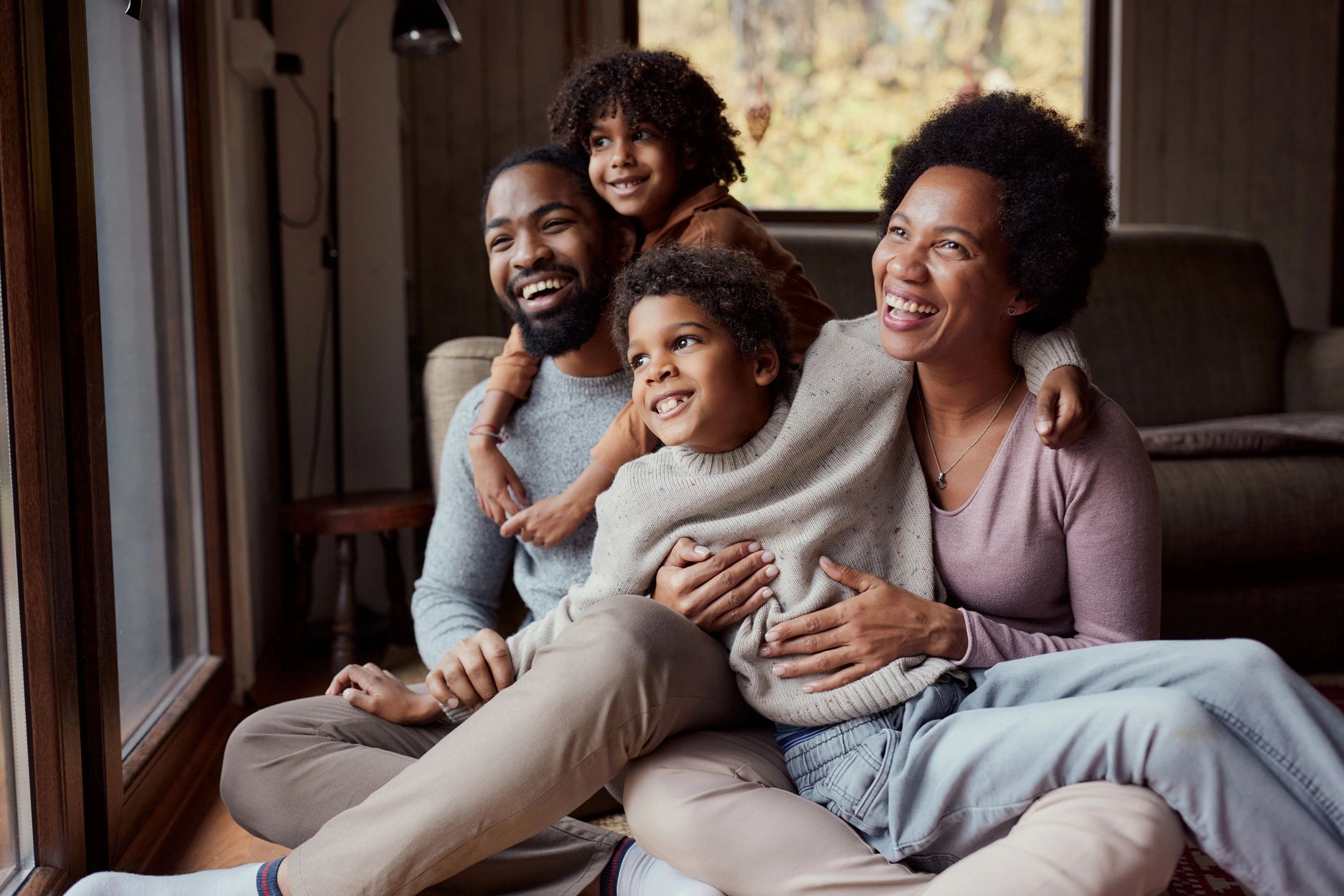 Family spending time together at home, smiling and connected