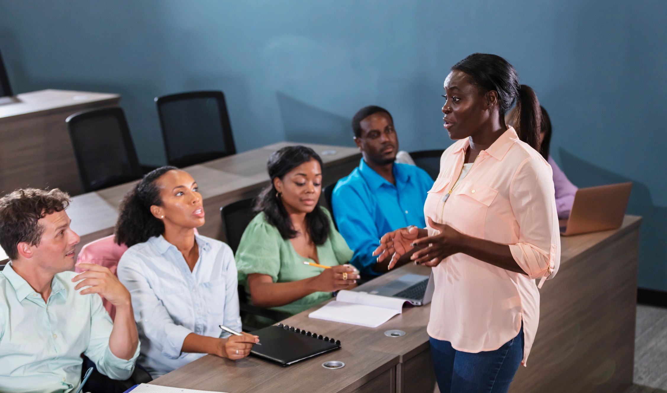 Instructor leading a workshop with adult learners
