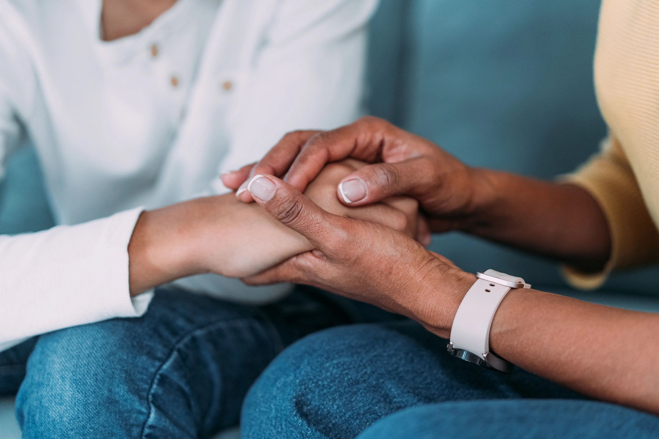 Supportive family moment holding hands
