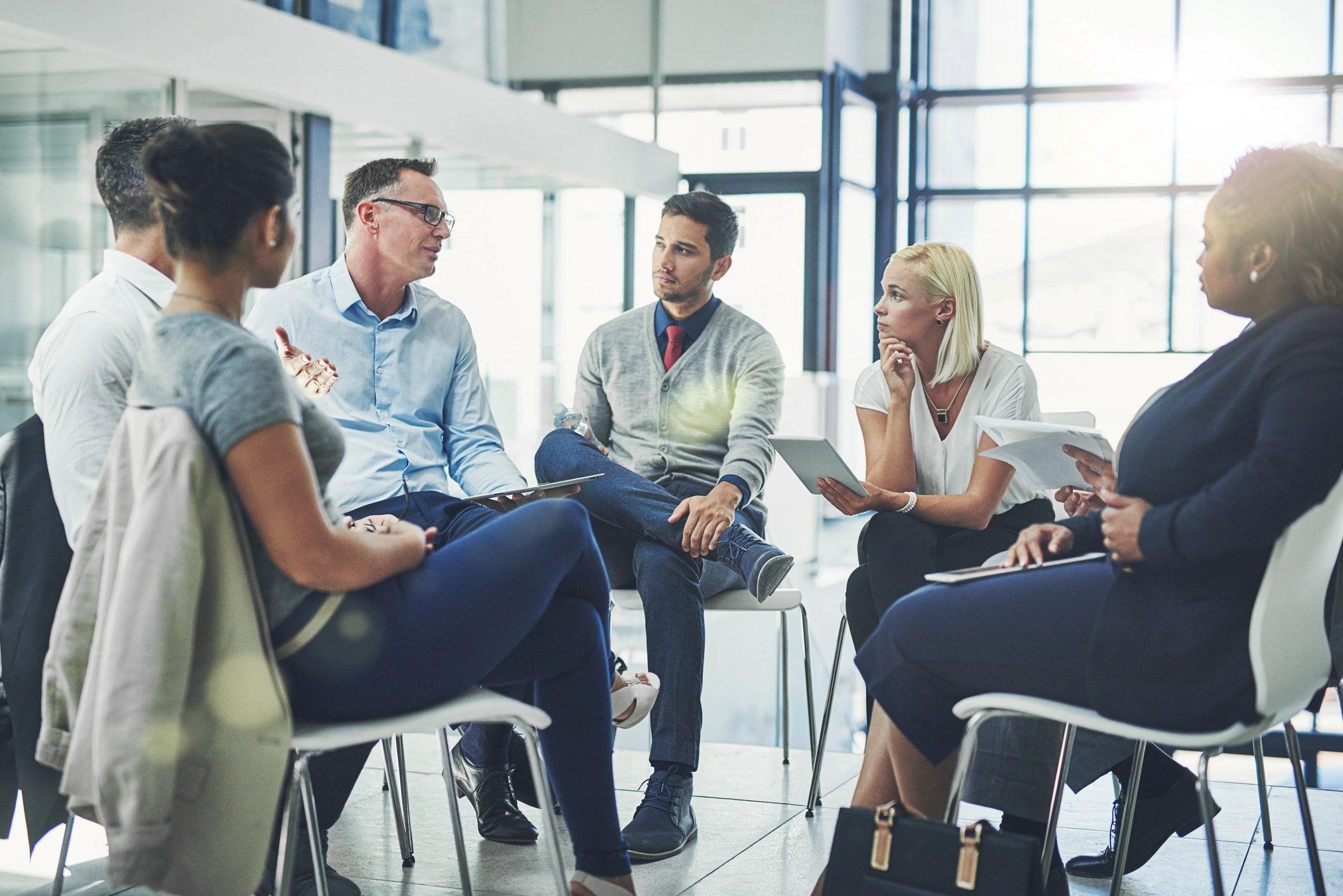 Small group discussion in a circle during a workshop